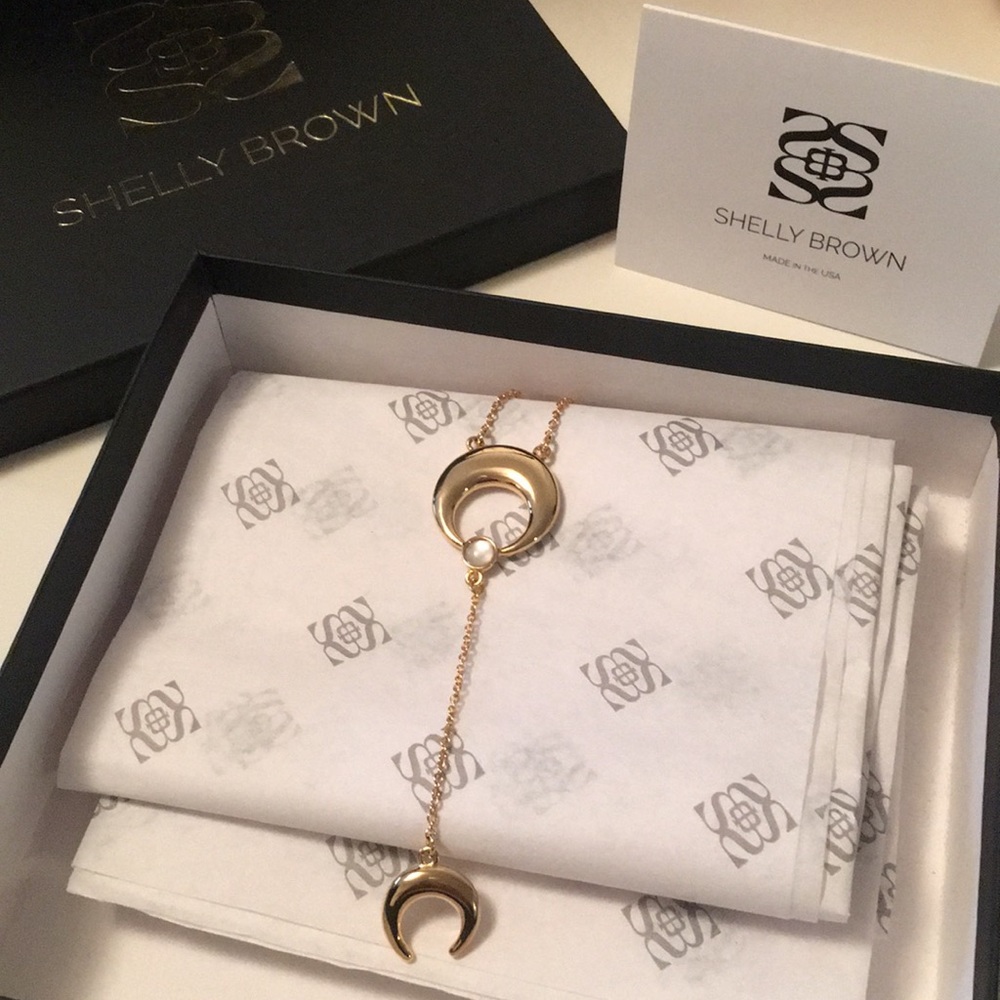 Shelly Brown crescent gold necklace